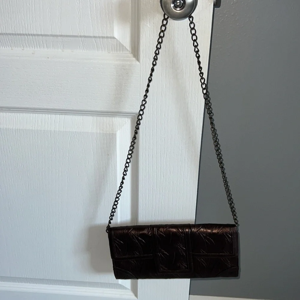 Brown shiny textured clutch bag with chair for shoulder bag‎